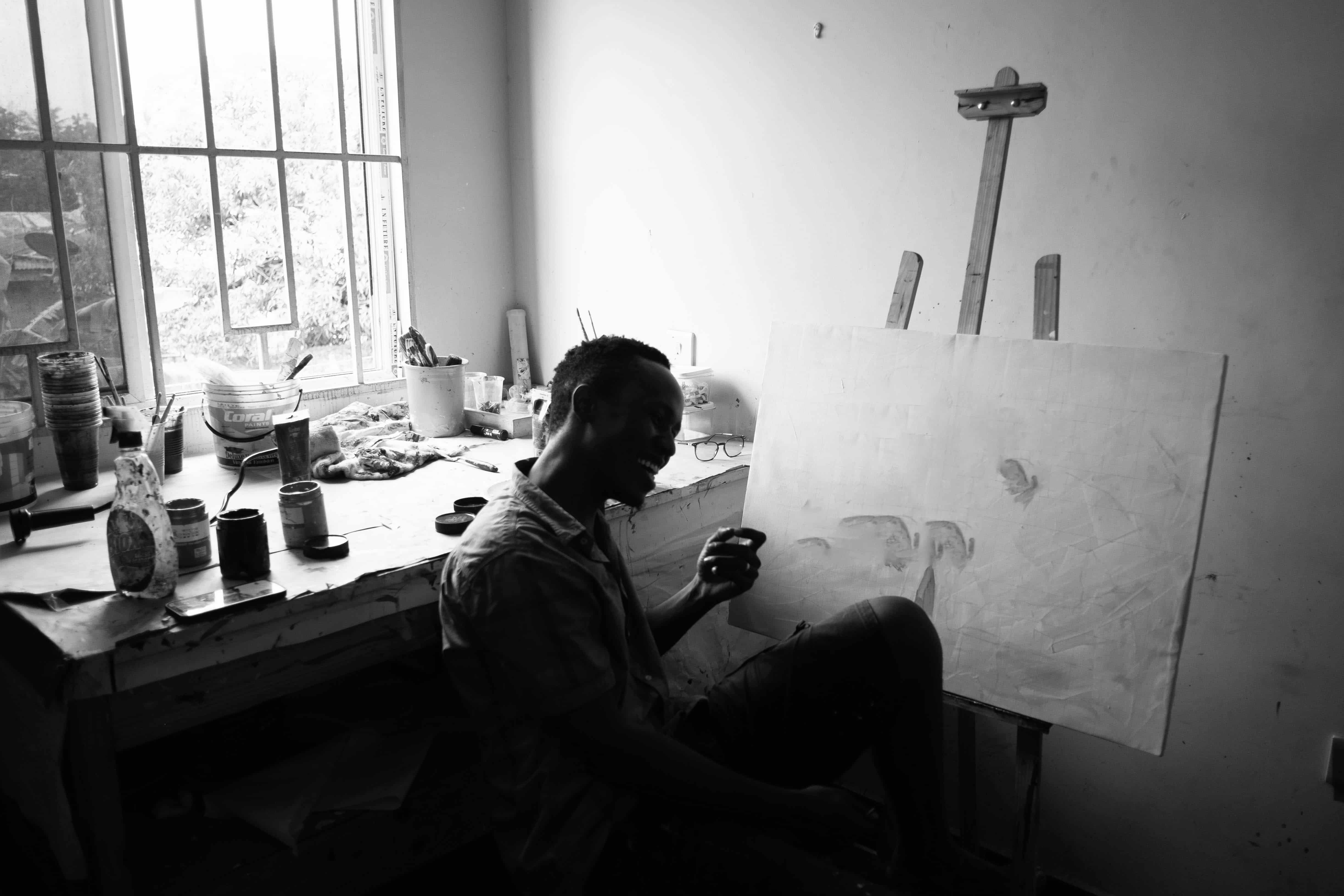 Nias Nyalada Art Studio Founder - Nias working in the studio on a painting